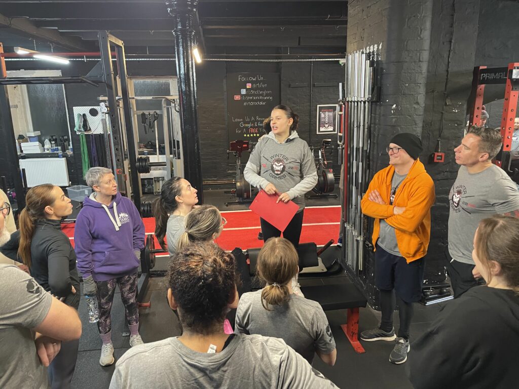 personal trainer leading a group training session at a personal training studio in Nottingham